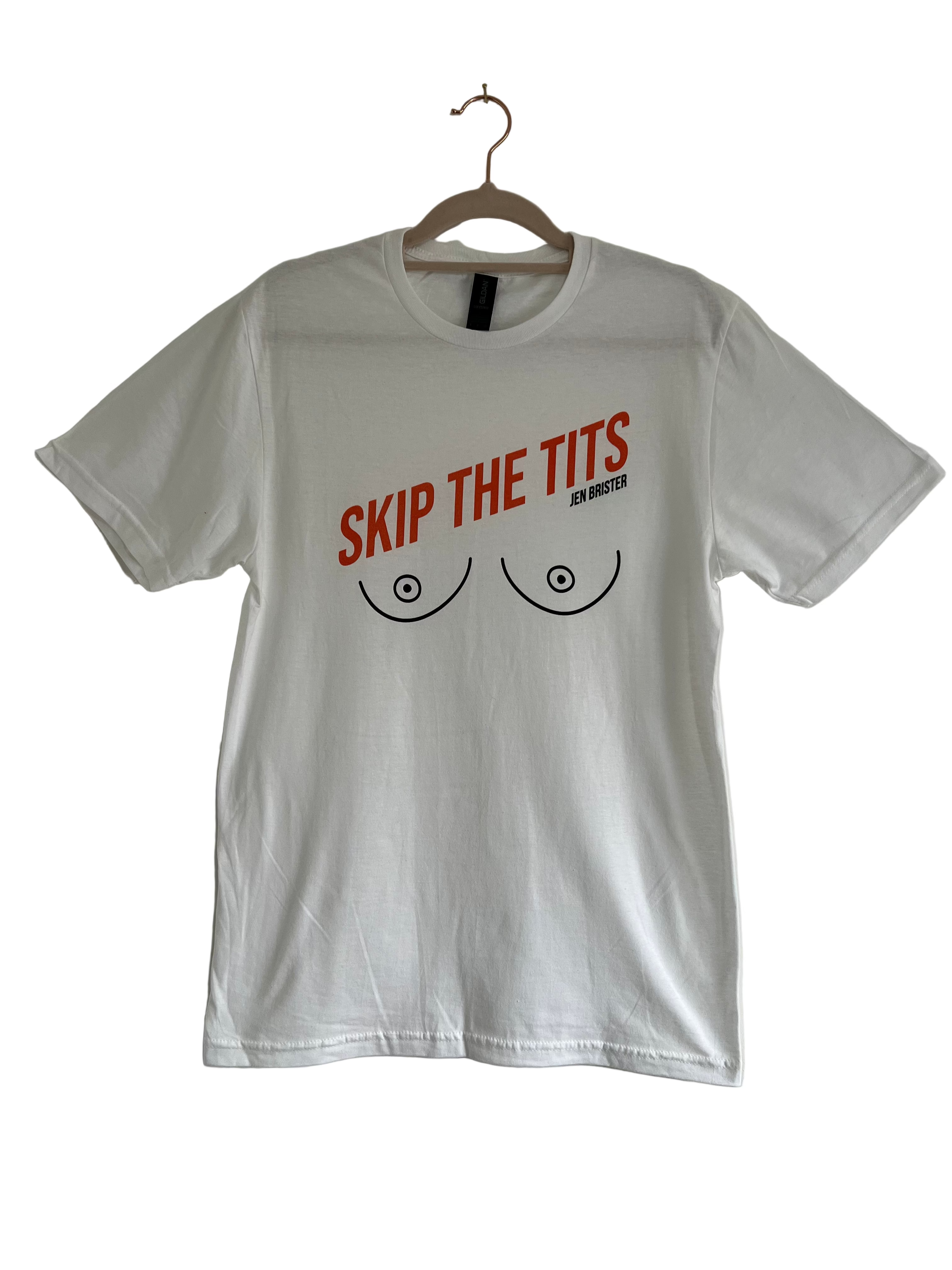 White t-shirt with orange text and graphic on a hanger against a plain background